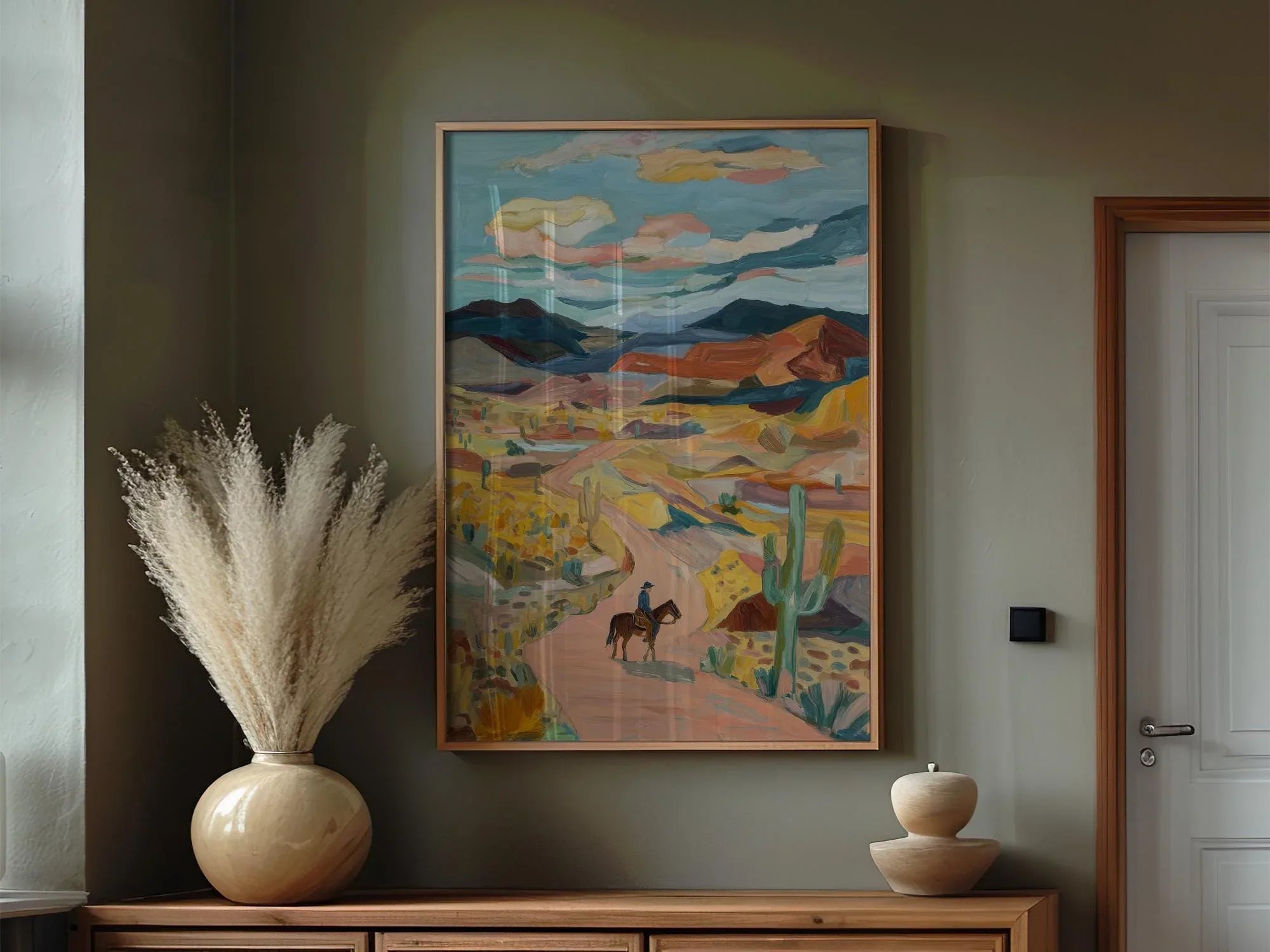 Desert cowboy wall art – lone horseback rider on Southwest trail with cacti and mountains