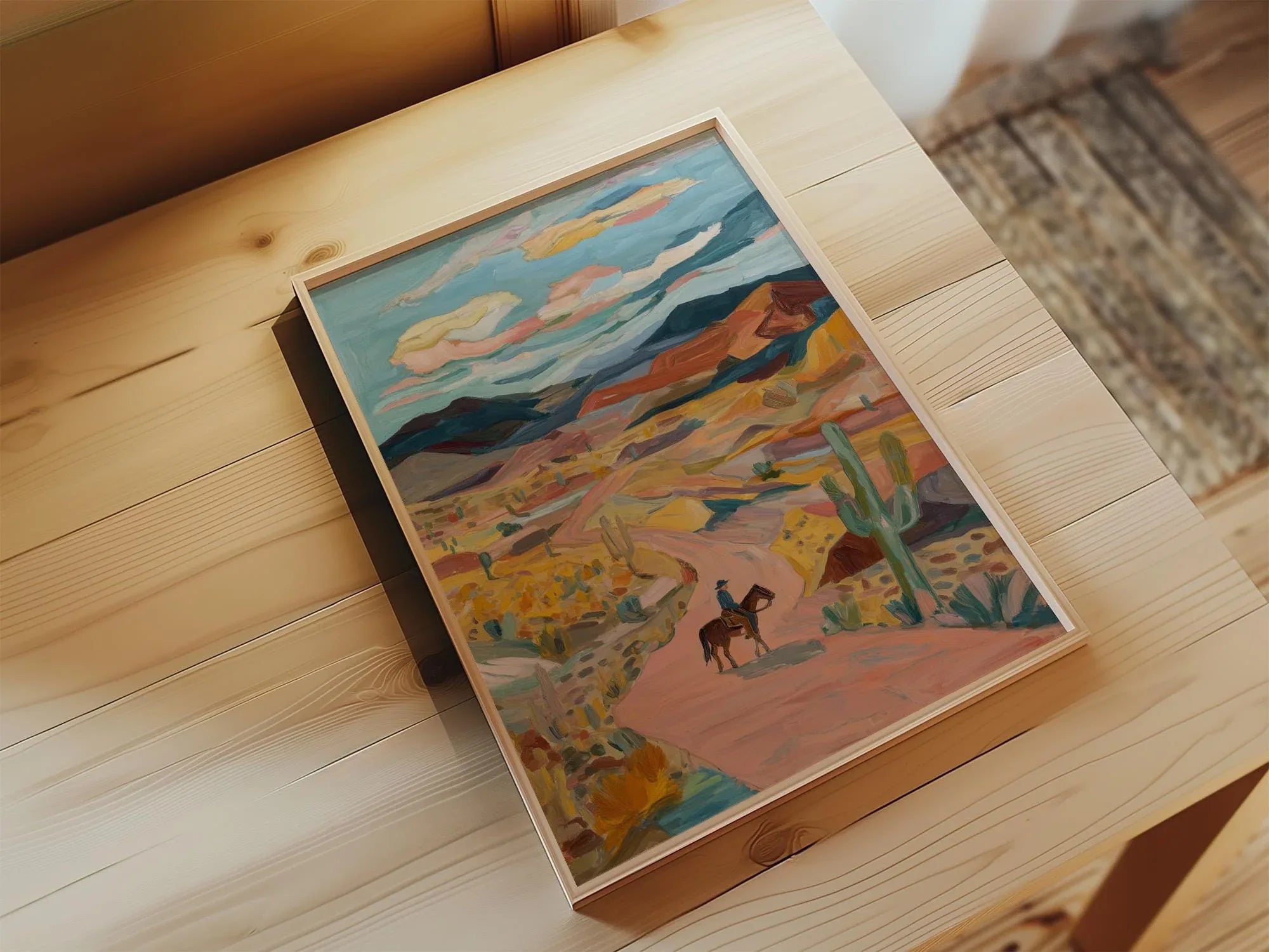 Desert cowboy wall art – lone horseback rider on Southwest trail with cacti and mountains