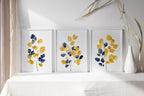 Mustard yellow and navy blue abstract leaf bouquet wall art set of 3 in modern wooden frame