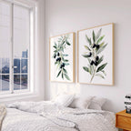 Olive branch botanical wall art set of 2 with green leaves and black olives on white background
