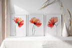 Red poppy watercolor wall art set of 3 – vivid crimson poppies with green stems on white background