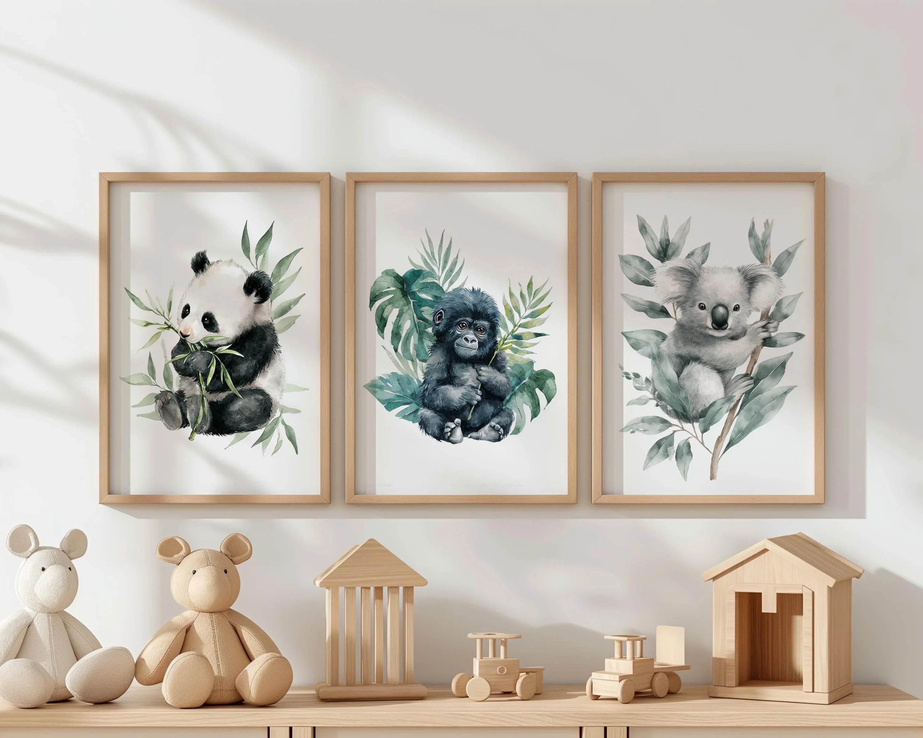 Nursery wall art set of 3 – watercolor panda, gorilla, and koala portraits with soft jungle foliage
