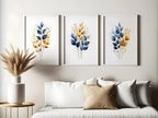 Gold and navy blue botanical watercolor wall art – elegant golden foliage on deep blue background
