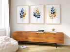 Gold and navy blue botanical watercolor wall art – elegant golden foliage on deep blue background