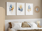 Gold and navy blue botanical watercolor wall art – elegant golden foliage on deep blue background