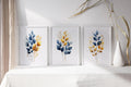 Gold and navy blue botanical watercolor wall art – elegant golden foliage on deep blue background
