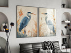 Blue heron wall art set of 2 – elegant watercolor bird portraits with botanical elements