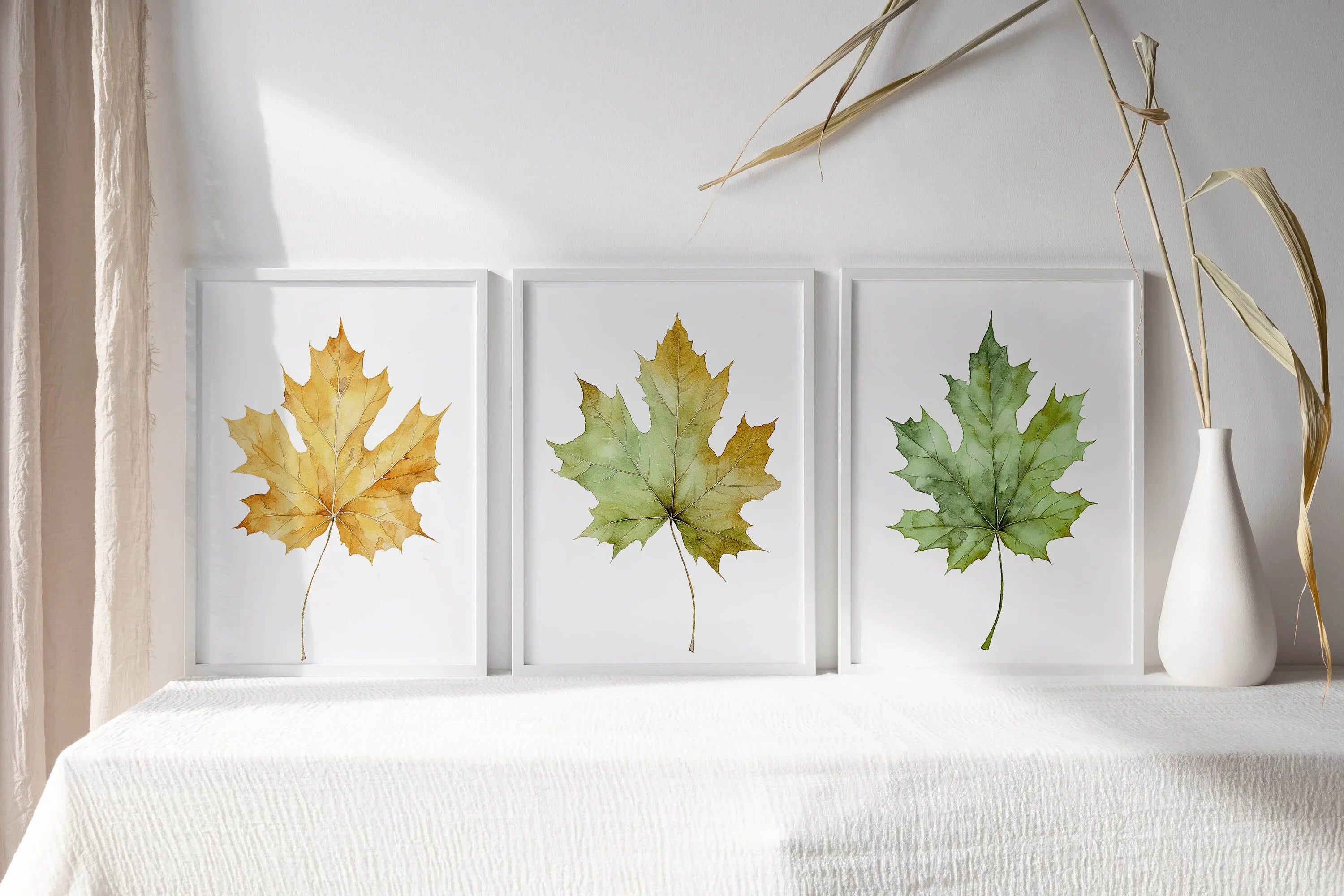 Maple leaf watercolor wall art set of 3 – autumn leaves in warm red, orange, and gold tones