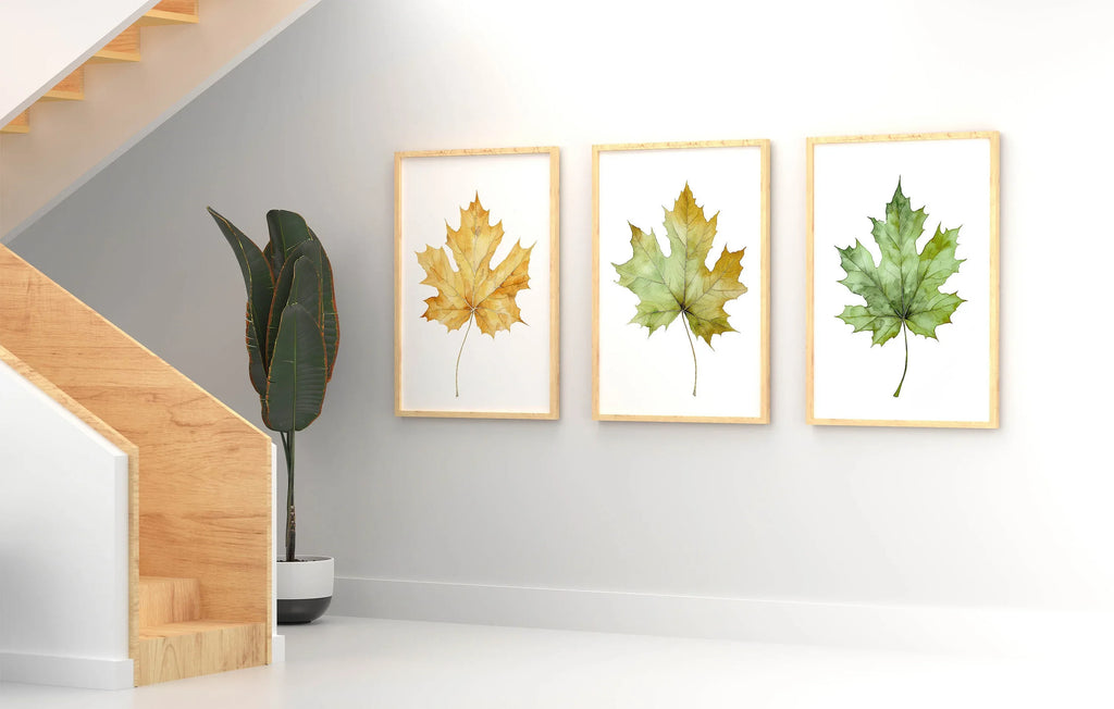 Maple leaf watercolor wall art set of 3 – autumn leaves in warm red, orange, and gold tones
